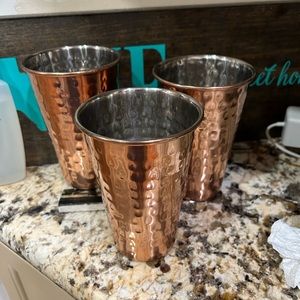 Three copper drinking cups